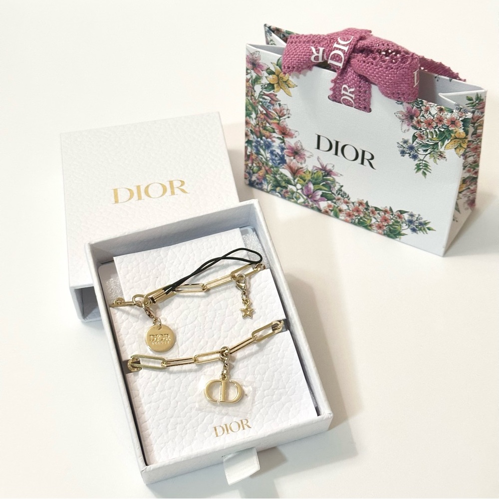 Dior gold phone charm